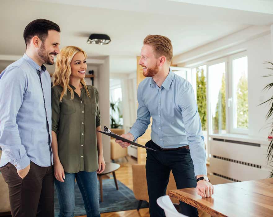 Couple selling their home with a real estate agent